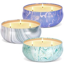 3 tin cans with lemongrass candles