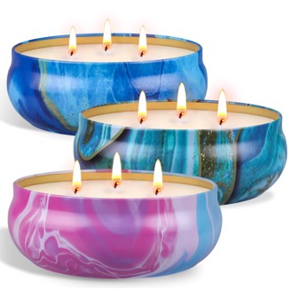 3 tin cans with lemongrass candles