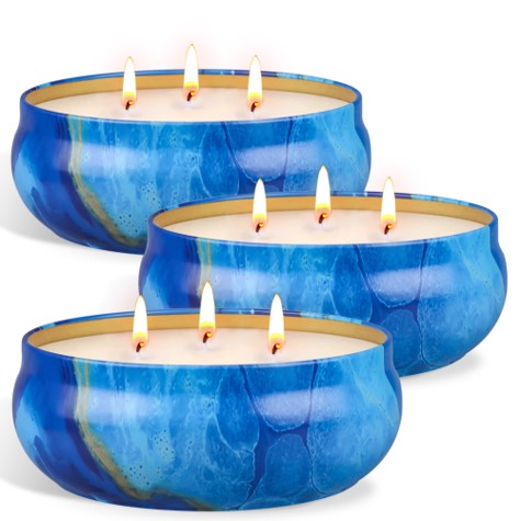 3 tin cans with lemongrass candles