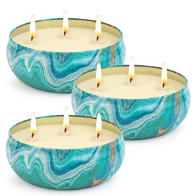 3 tin cans with lemongrass candles