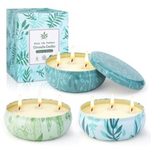 3 tin cans with lemongrass candles